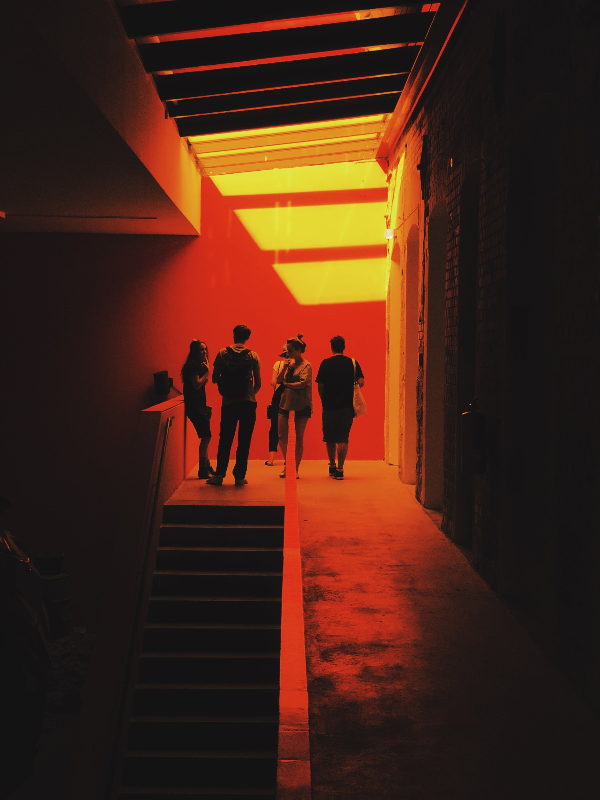 A group of couples upstairs at a swinger party