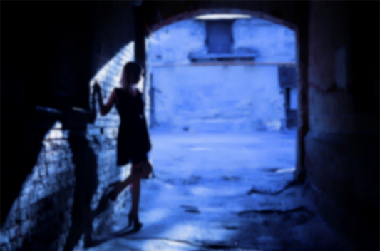 A silhouette of a slutty woman in a black alley (blurred background)